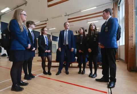 PA Paul Givan speaking to students during a visit to St Columbanus' College in Bangor on Tuesday