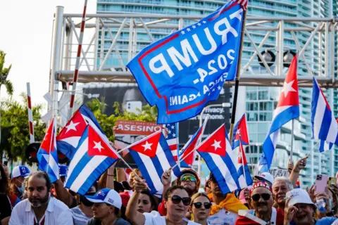 Getty Images Cuban-Americans rally for Trump with flags and signs