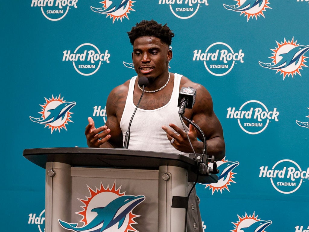 MIAMI GARDENS, FL - SEPTEMBER 8: Wide Receiver Tyreek Hill #10 of the Miami Dolphins addresses the media during the post-game press conference after playing the Jacksonville Jaguars at Hard Rock Stadium on September 8, 2024 in Miami Gardens, Florida. Hill was handcuffed and placed facedown on a street by police officers after he was stopped for a traffic violation near Hard Rock Stadium just hours before his team was to open the 2024 football season. The Dolphins defeated the Jaguars 20-17. (Photo by Don Juan Moore/Getty Images)