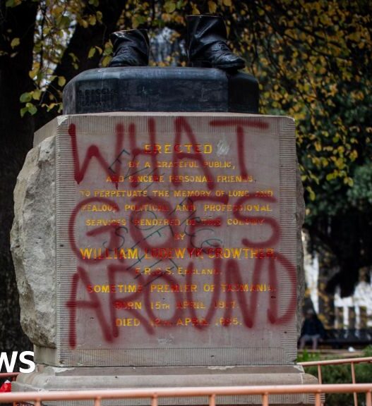 A severed statue divides an Australian city