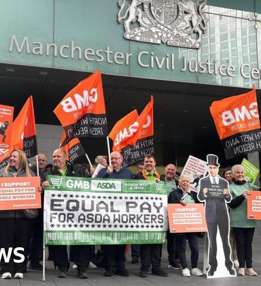 Asda workers hold rally as equal pay case begins in Manchester