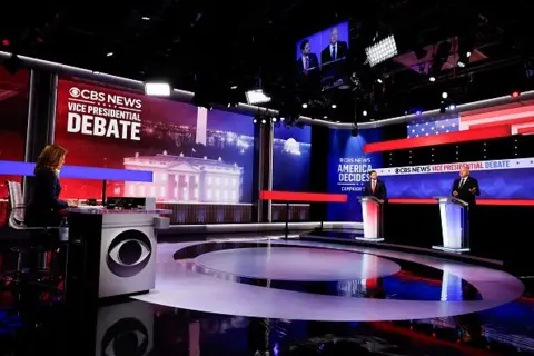 Getty Images Vice presidential candidates JD Vance (left) and Tim Walz on the debate stage