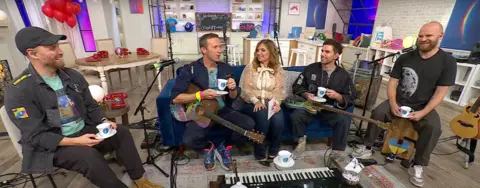 QVC Coldplay appear on QVC with host Jennifer Coffey