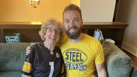 Handout Tim Anzelone with his grandmother at the Steelers party