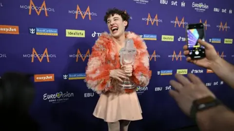 EPA Nemo celebrates backstage at the Eurovision Song Contest