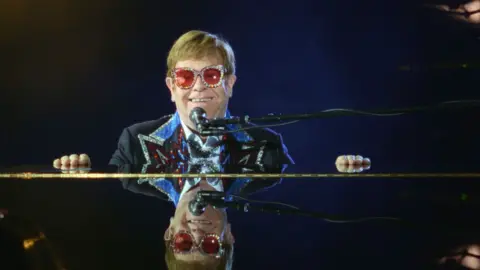 Disney+ Sir Elton John takes a moment to enjoy his final concert tour performance at Dodger Stadium on November 20, 2022