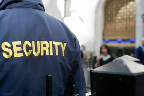 Getty Images The back of a security gaurd