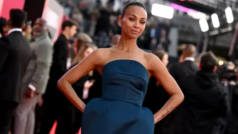 Getty Images US actor Zoe Saldaña poses on the red carpet upon arrival to attend the Gala screening of "Emilia Perez" at the Royal Festival Hall, during the 2024 BFI London Film Festival in London, on October 11, 2024.