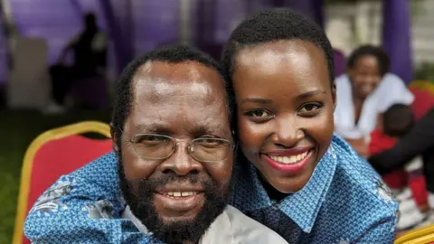 Lupita Nyong'o Anyang' Nyong'o and his daughter Lupita Nyong'o embrace and pose for a photo 