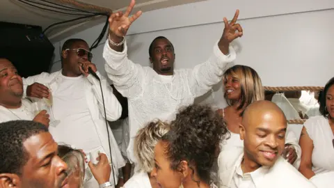 Getty Images Sean "Diddy" Combs photographed throwing up peace signs at his after party for "The Real White Party" on September 2, 2007 in East Hampton, New York.