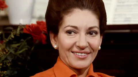 Maria Callas pictured in 1973, wearing an orange shirt