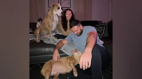 Chynna Perkins Chynna and Sterling Perkins with their two dogs