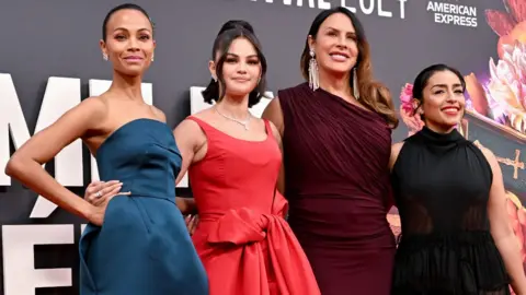 Getty Images Zoe Saldaña, Selena Gomez, Karla Sofía Gascón and Adriana Paz attend the "Emilia Perez" Headline Gala during the 68th BFI London Film Festival at The Royal Festival Hall on October 11, 2024 in London, England