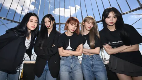 Getty Images K-pop band Le Sserafim pose at the top of the Empire State Building in New York while promoting their fourth mini-album, Crazy