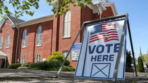 Getty Images A "vote here" sign is seen outside of the Shiloh United Church of Christ which served as a polling station in Pennsylvania's primary election on Tuesday, April 23, 2024.