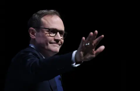 EPA Conservative Party Leadership candidate Tom Tugendhat waves at the crowd during a speech at the final day of the Conservative Party Conference in