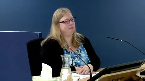 Covid Inquiry Photograph of Tamsin Mullen giving evidence in the inquiry room